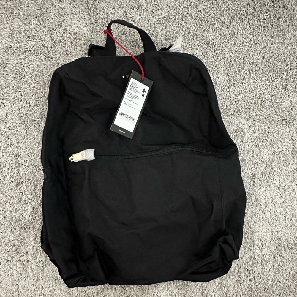 Tumi Just In Case Black Backpack with Storage Bag